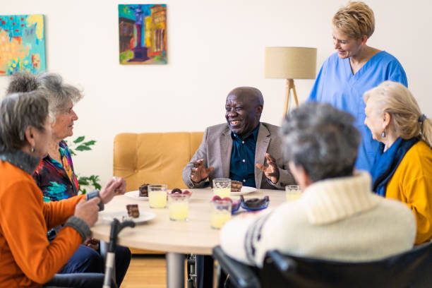 istock Happy elderly retired people having some cake and cool drinks 2148073222