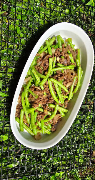 String green bean or french beans with minced beef stir fry or sauteed called Tumis buncis daging sapi cincang in Indonesia