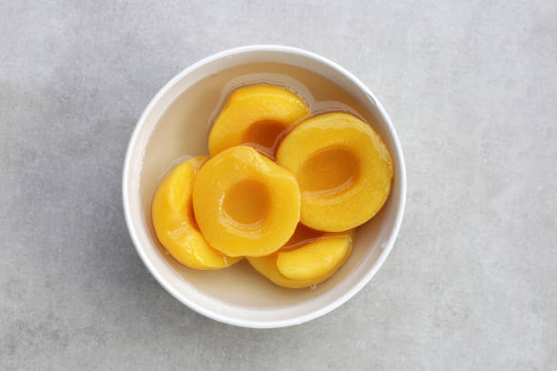 istock Peach halves in syrup. Fruity desserts 2148074698