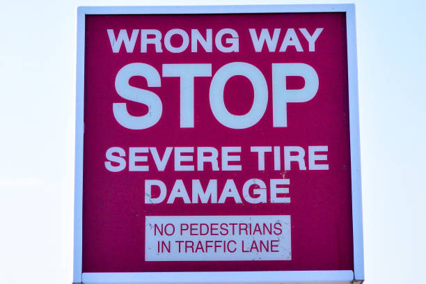 istock Red wrong way stop severe tire damage sign 2148075575
