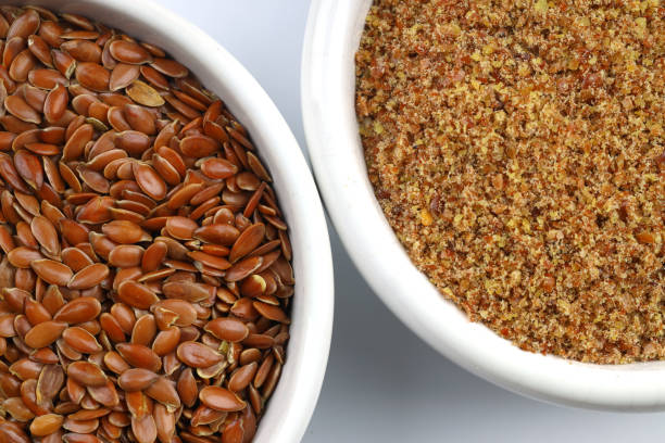 istock Pile of flax seeds isolated on white background 2148075955