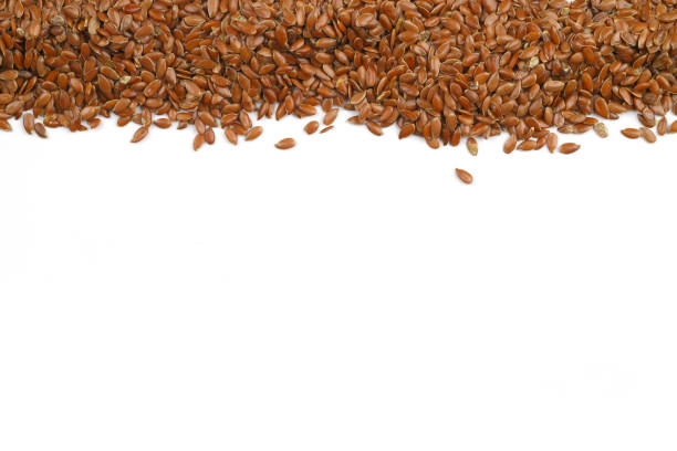 istock Pile of flax seeds isolated on white background 2148075971