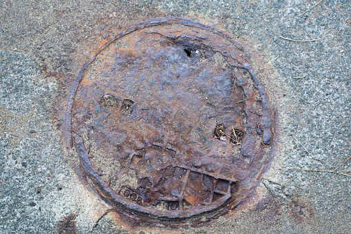 Very old and rusty manhole