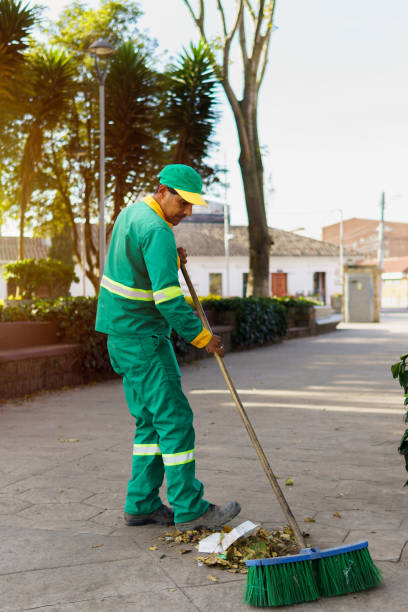 istock A municipal worker, dressed in a green uniform 2148078315