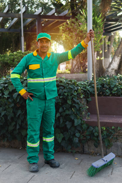 istock a cleaning worker looking at camera in a park 2148078326