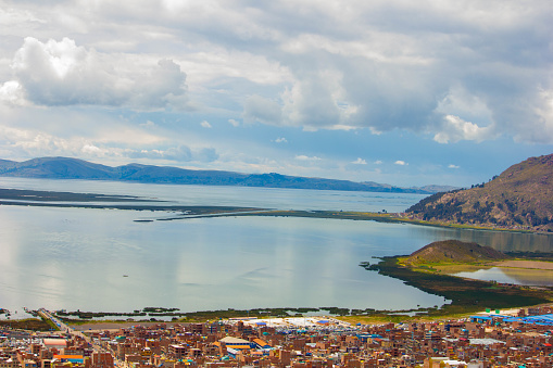 Lake Titicaca and city Puno from viewpoint Condor in Peru
