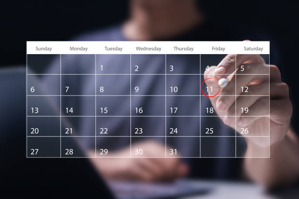 istock Time management concept. Man use laptop to manage time for effective work. Calendar on the virtual screen interface. Highlight appointment reminders and meeting agenda on the calendar. 2148078992
