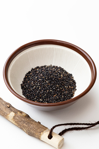 black sesame seeds in mortar