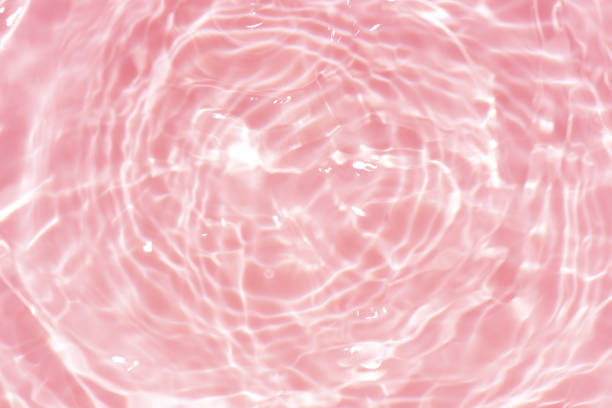 istock Bluewater waves on the surface ripples blurred. Defocus blurred transparent blue colored clear calm water surface texture with splash and bubbles. Water waves with shining pattern texture background. 2148081454