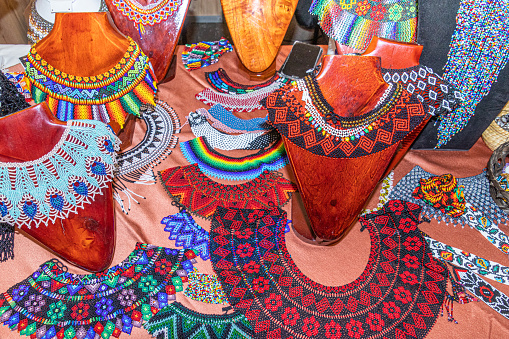 Beaded jewelry in the form of necklaces, bracelets and other items made by women of the Saraguro ethnic group, Loja province, Ecuador, at a craft fair.