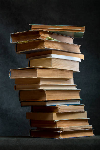 istock A stack of old books and notebooks on the table 2148087471