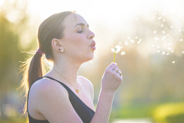 Happy woman having overcome her allergy to pollen. Woman without allergy. Spring without allergies. Happy woman without allergy. Copyspace