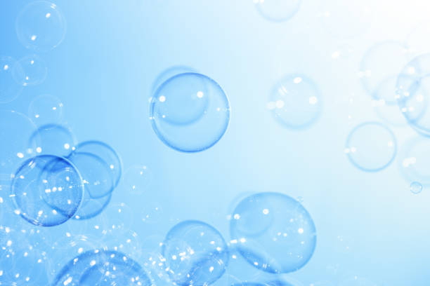 istock Beautiful Transparent Soap Bubbles Floating in The Air.  Celebration Festive Backdrop. Freshness Soap Suds Bubbles Water. Abstract Blue Textured Background. 2148089752