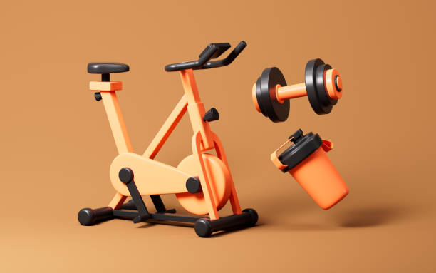 istock Cartoon exercise bike, dumbbell and cup on the orange background, 3d rendering. 2148090395