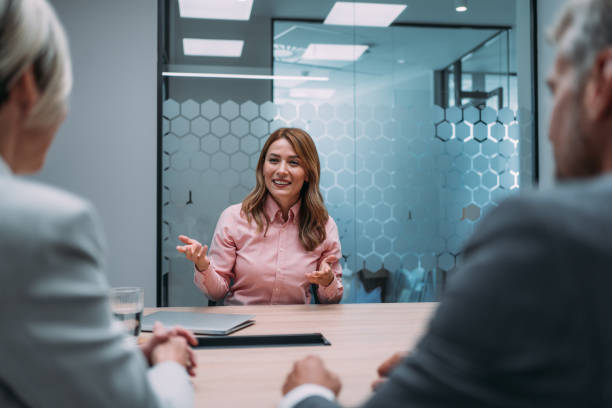 istock Group of business persons talking in the office. 2148092477