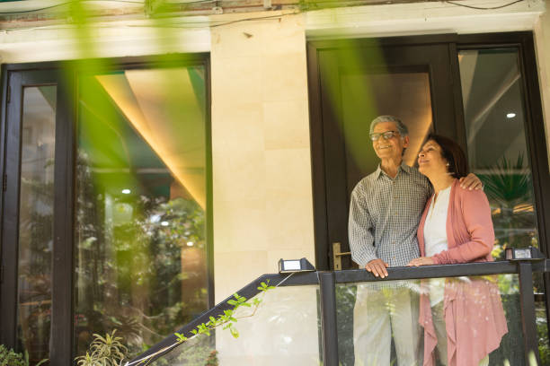 istock Old couple spending leisure time in balcony 2148095158
