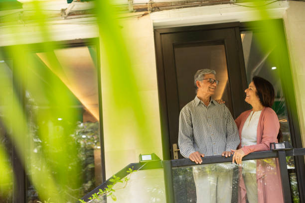 istock Old couple spending leisure time in balcony 2148095178