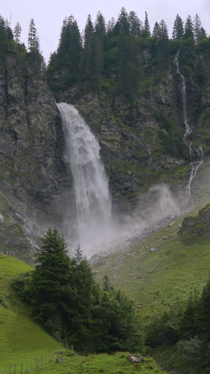 Idyllic Stäubifall waterfall and village