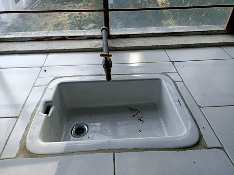 Simple view from above of an empty kitchen sink in a typical house.