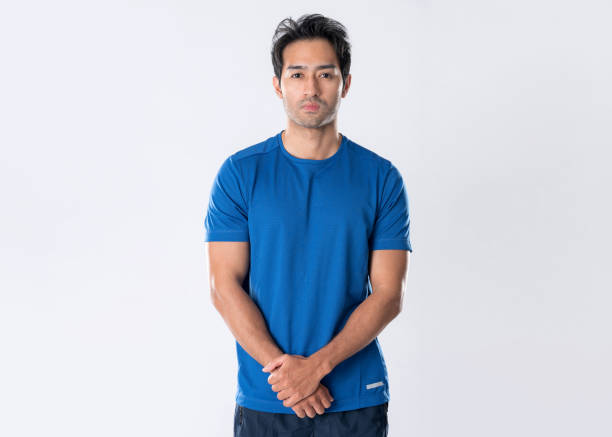 istock Elegant young man in blue shirt standing on white background 2148098537