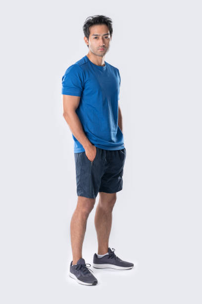 istock Elegant young man in blue shirt standing on white background 2148098541