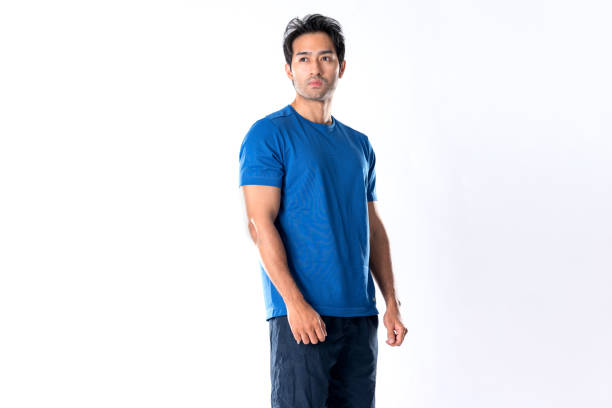 istock Elegant young man in blue shirt standing on white background 2148098555