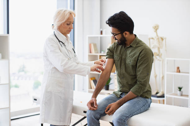 istock General practitioner giving injection to boost immunity for young patient. 2148098729