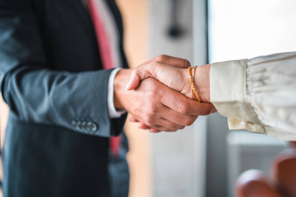 istock Professional Handshake Between Asian Businessman and Female Client 2148098964