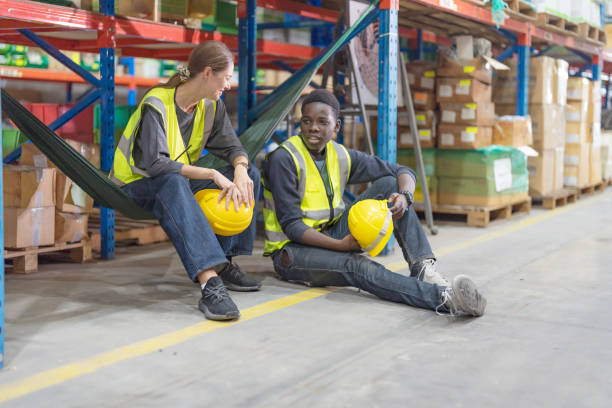 istock Male and female employees sit and chat. 2148101075