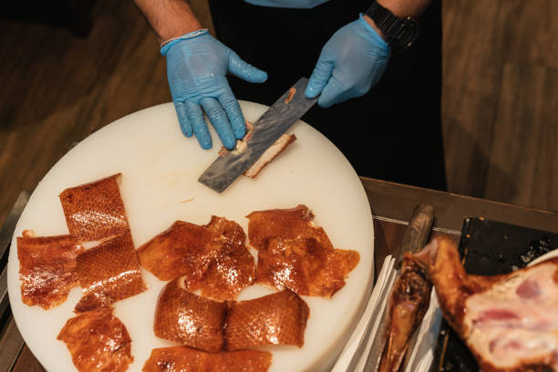 istock Cutting of Peking Roast Duck. 2148101121