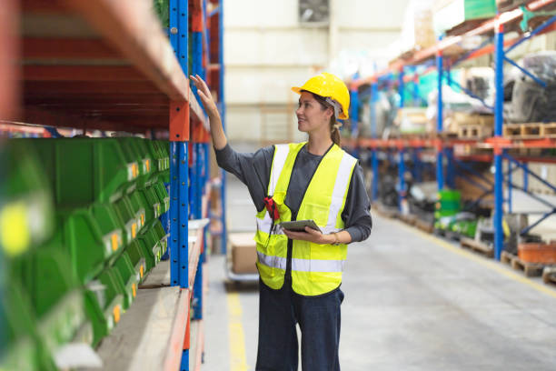 istock Female employees checking products. 2148101146