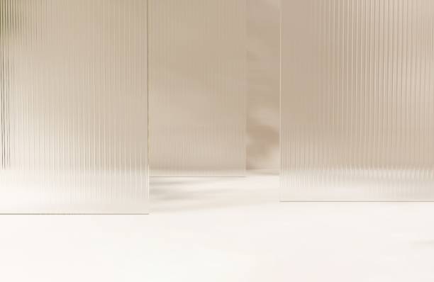 istock Three layers of clean fluted reeded glass in dappled sunlight, tree leaf shadow on white floo 2148101256