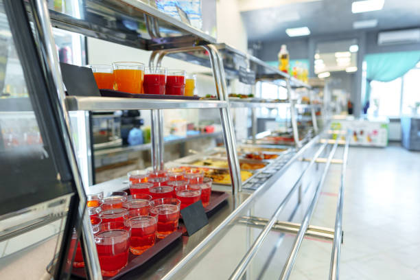 istock Colorful Array of Fruit Juice Cups on a Serving Cart in a Cafeteria 2148101613