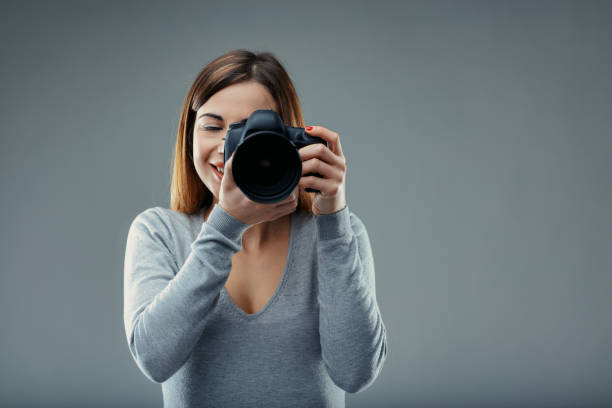 istock Camera in focus, she awaits the shot 2148101945