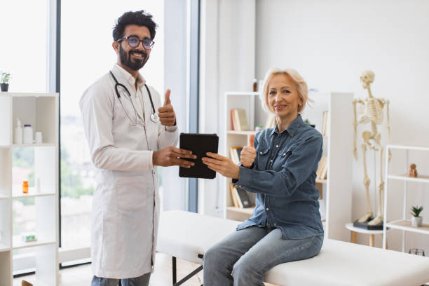 istock Portrait of bearded physician using tablet for writing electronic prescription. 2148102236