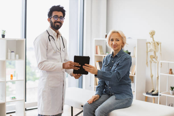 istock Portrait of bearded physician using tablet for writing electronic prescription. 2148102238