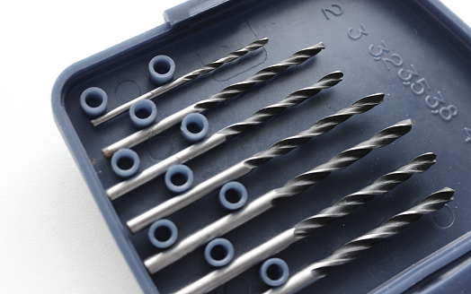 Five variety diameter metal drills in plastic box with indicating the drill diameter in millimeters