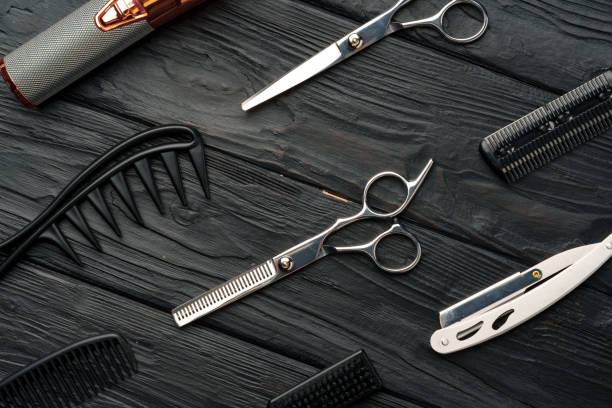 istock Professional Barber Tools Laid Out on Dark Wooden Surface 2148104079