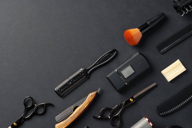 istock An Assortment of Professional Hairdressing Tools Laid Out on a Dark Surface 2148104411