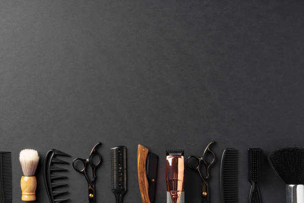 istock An Assortment of Professional Hairdressing Tools Laid Out on a Dark Surface 2148104626