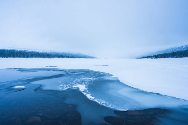 istock Ice formations on frozen lake in winter 2148105023