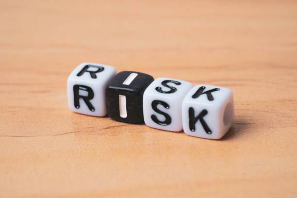 istock Risk wording on white and back cube for risk assessment management concept. 2148106187