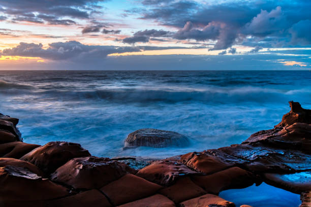 istock Sunrise, sea, waves, clouds and tessellated rock platform 2148106606