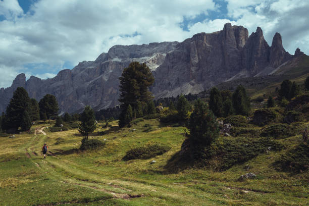 istock Woman hiking outdoors on the Dolomiti in summer 2148106933