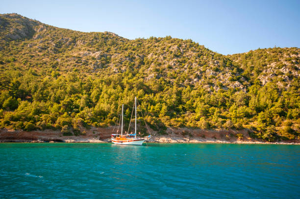 Anchored wooden yacht