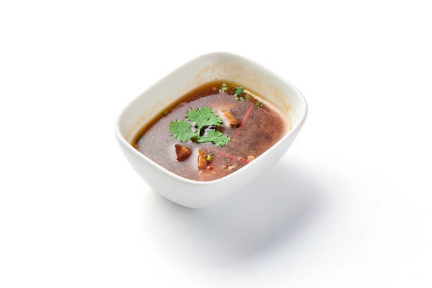 istock Shiitake mushroom soup in bowl isolated on white background. 2148108745
