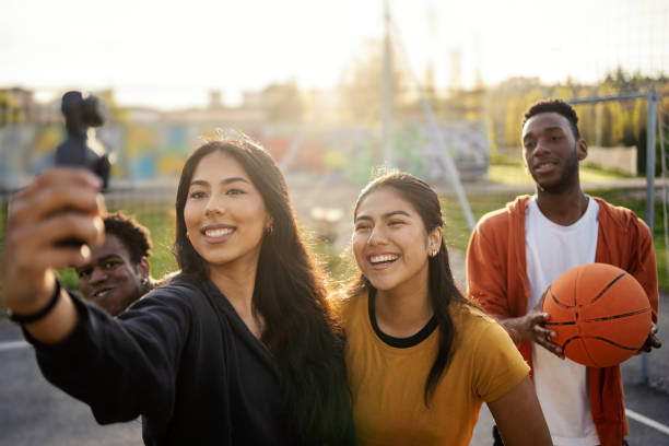 istock Friends taking selfie playing basketball with a wearable camera 2148109164