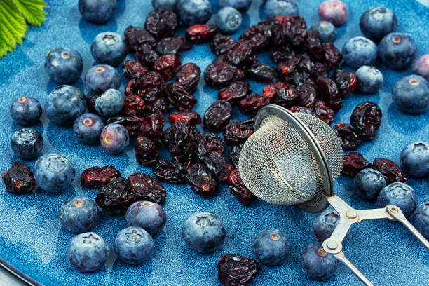 Set of fresh blueberries and dried cranberries. Berries for berry tea.