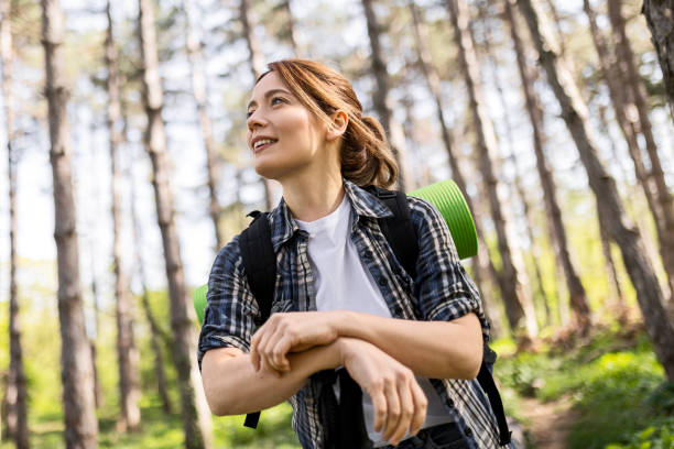 istock An attractive young woman hiking taking a break 2148109326