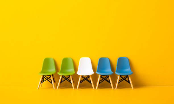 istock whIte chair standing out from the crowd. Business concept. 2148109342